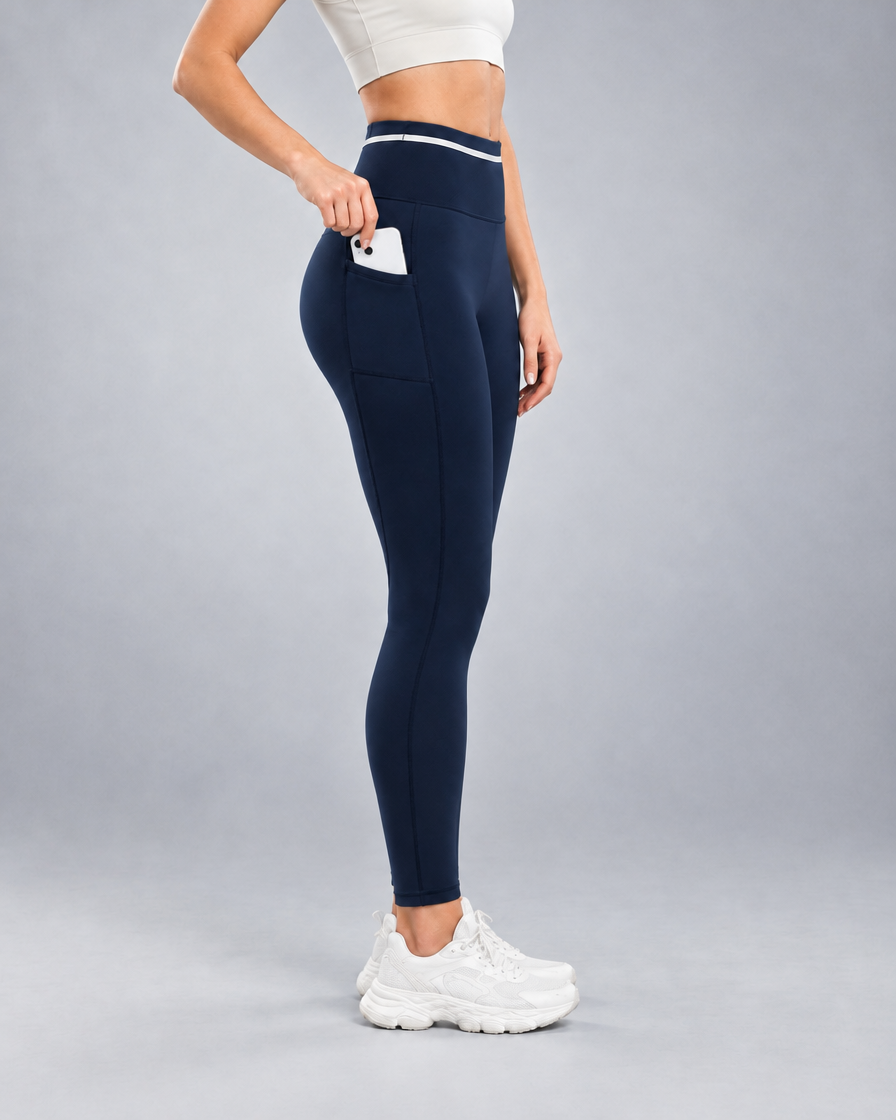 Women's Pro Winter Running Tight in Navy, Side thigh pocket holding a phone